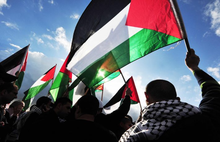 https://www.shutterstock.com/image-photo/erez-crossingdec-31palestinians-carry-palestinians-flags-146750888